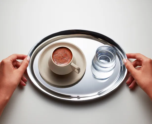 Turkish coffee served on a tray with water